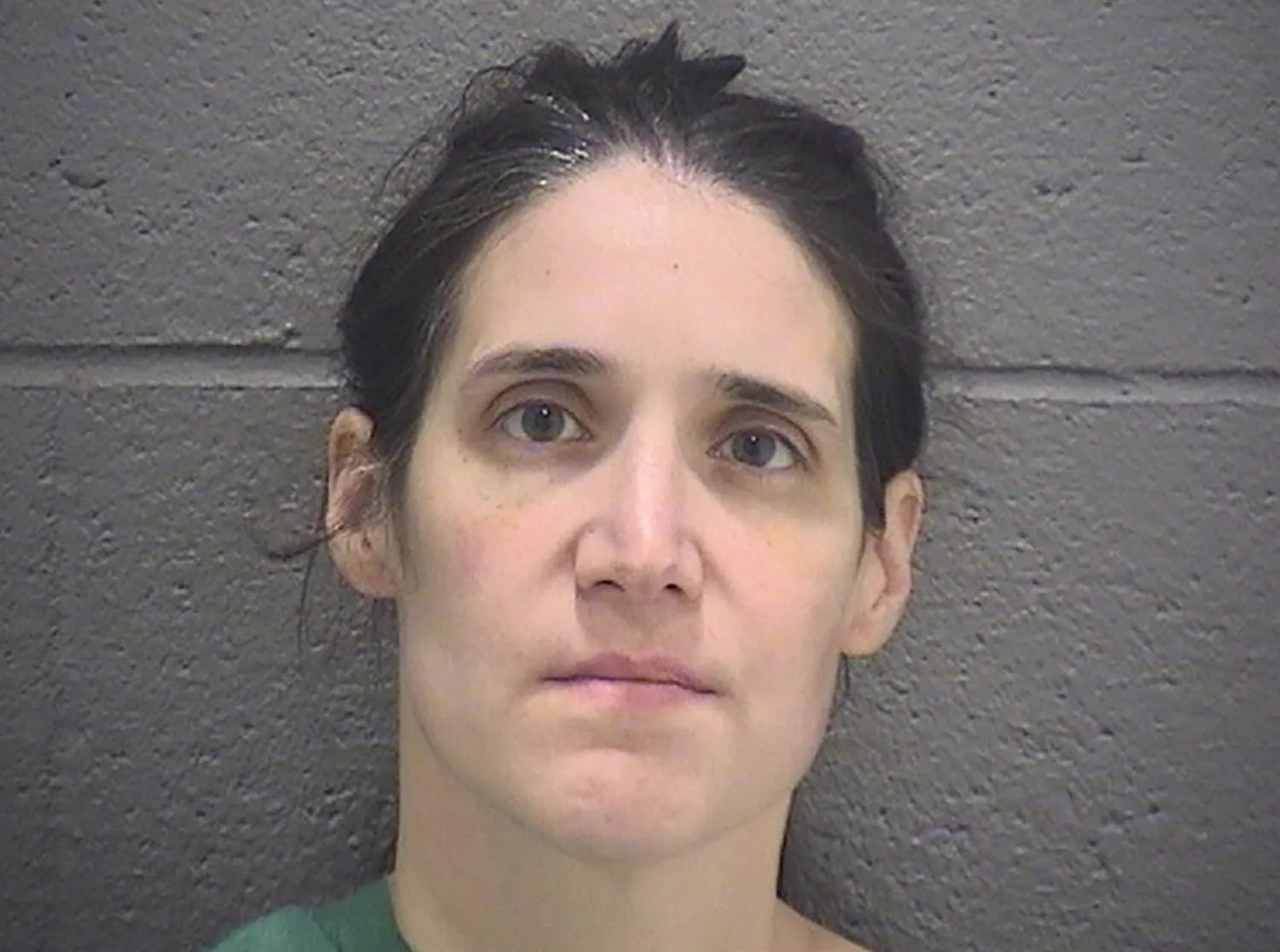 Booking photo of Andrea Faust, the Durham mother charged with first-degree murder and attempted murder in the deaths and injuries of her two young children.